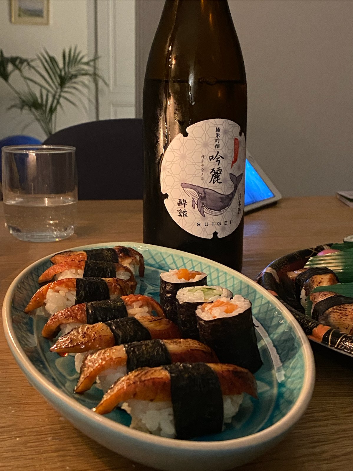 Sake bottle and sushi from Tanuki at home