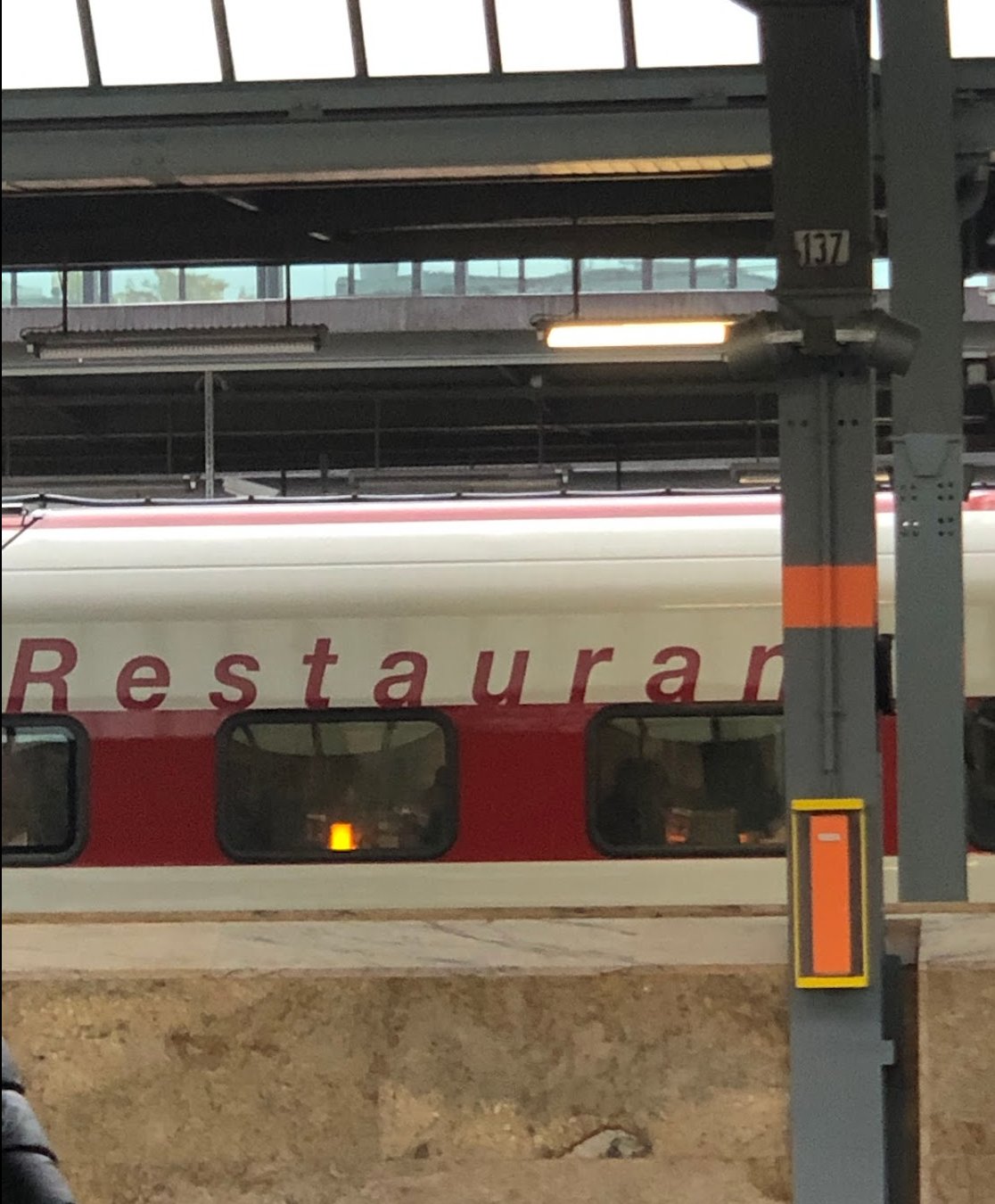 Restaurant car sign on the side of the train at the platform — you can't miss it