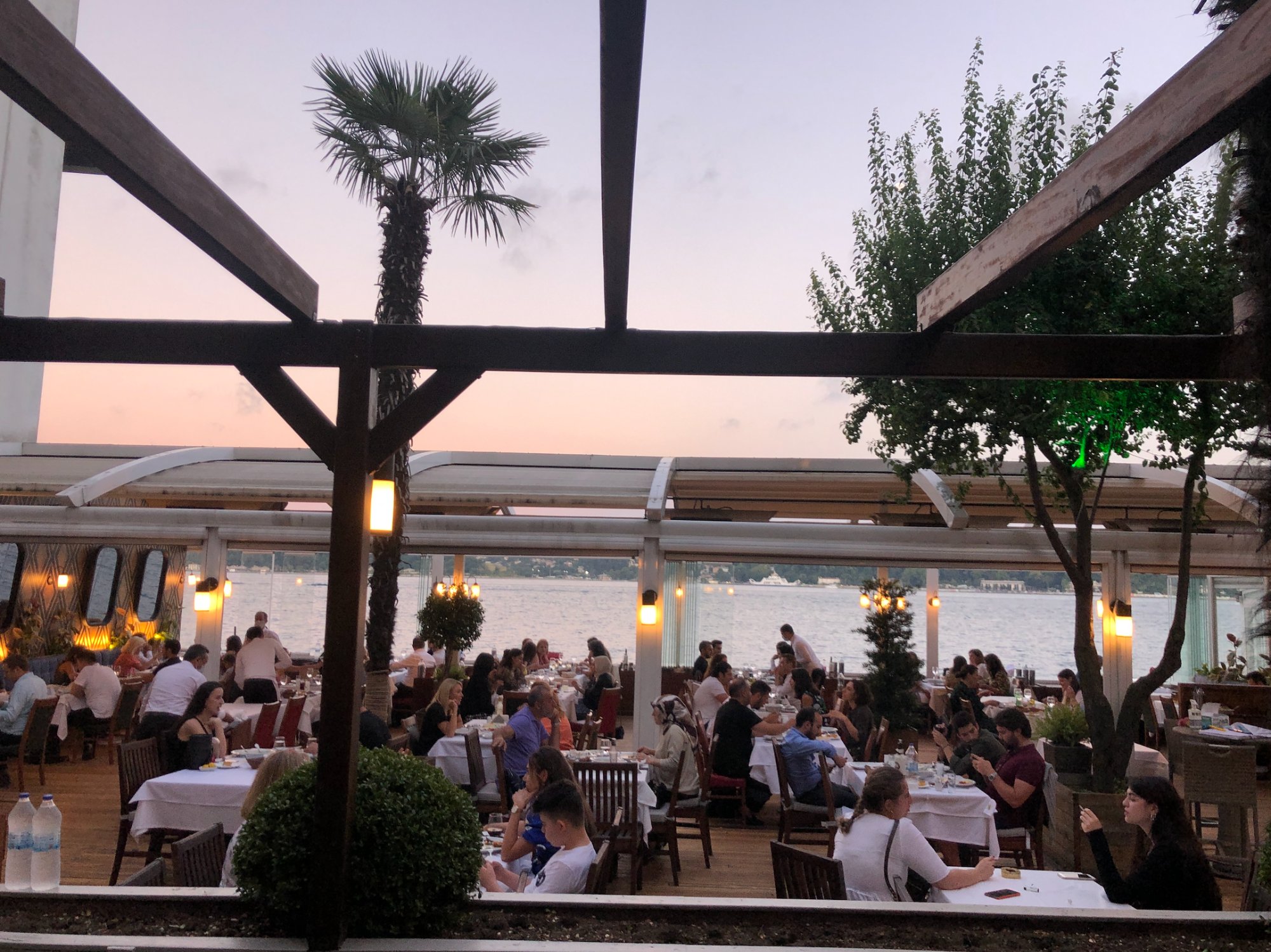 Arnavutköy Restaurant terrace at dusk, Bosphorus behind