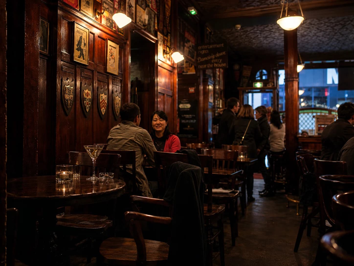 The dark wood interior and intimate tables at Harry's New York Bar in Paris