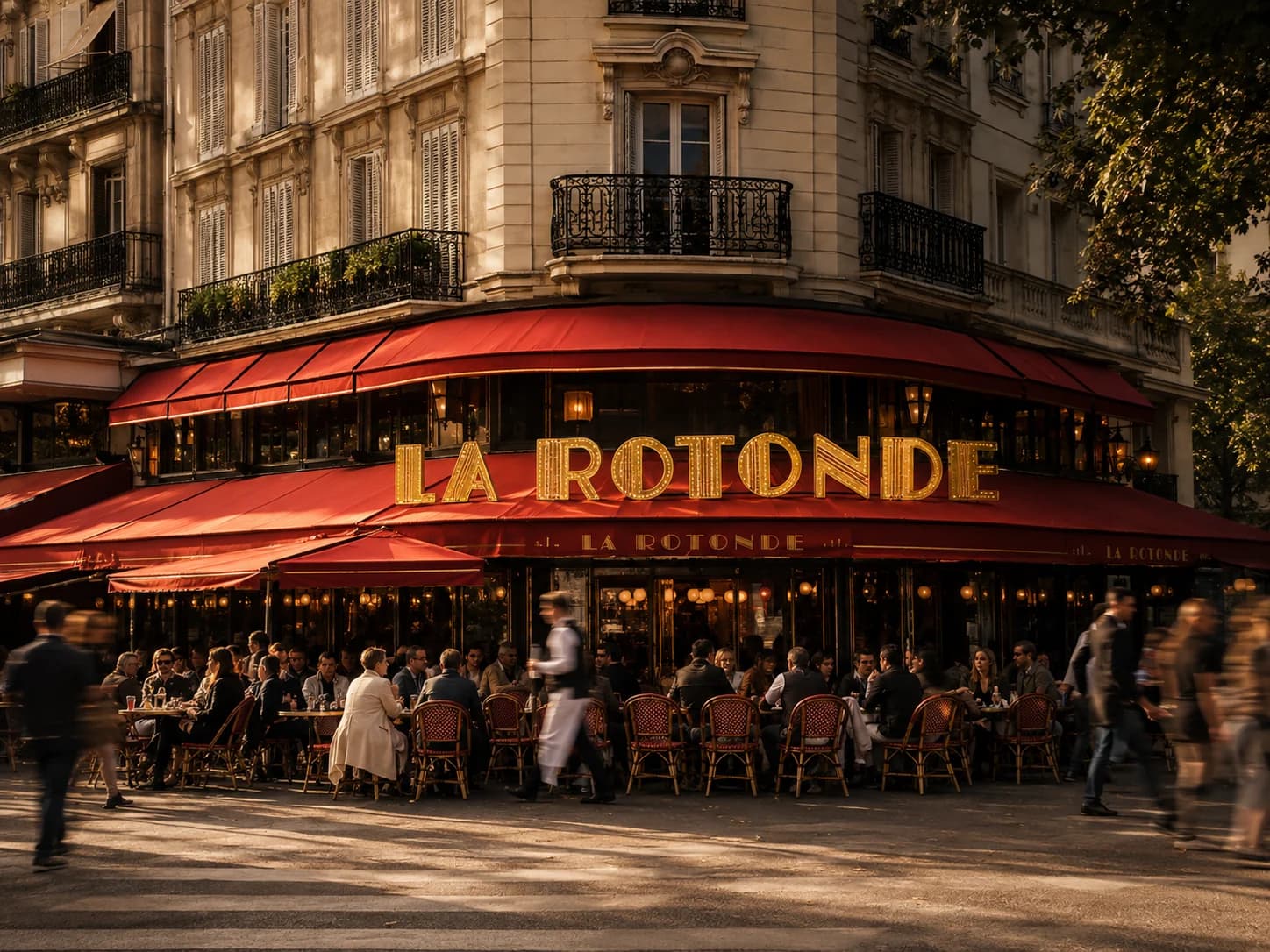 The red awning and busy sidewalk terrace at La Rotonde in Montparnasse