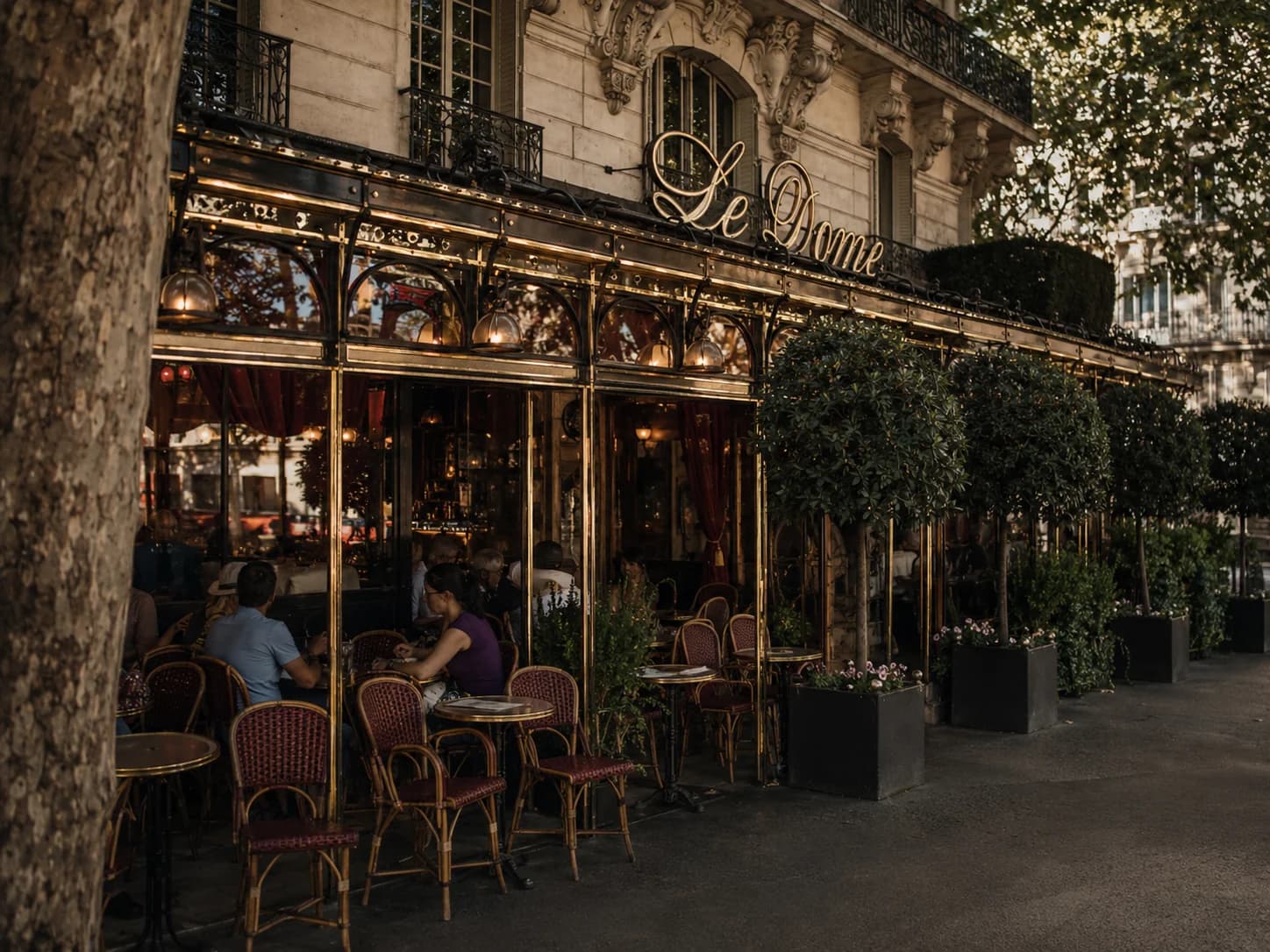 The brass-trimmed terrace and café chairs outside Le Dôme in Montparnasse