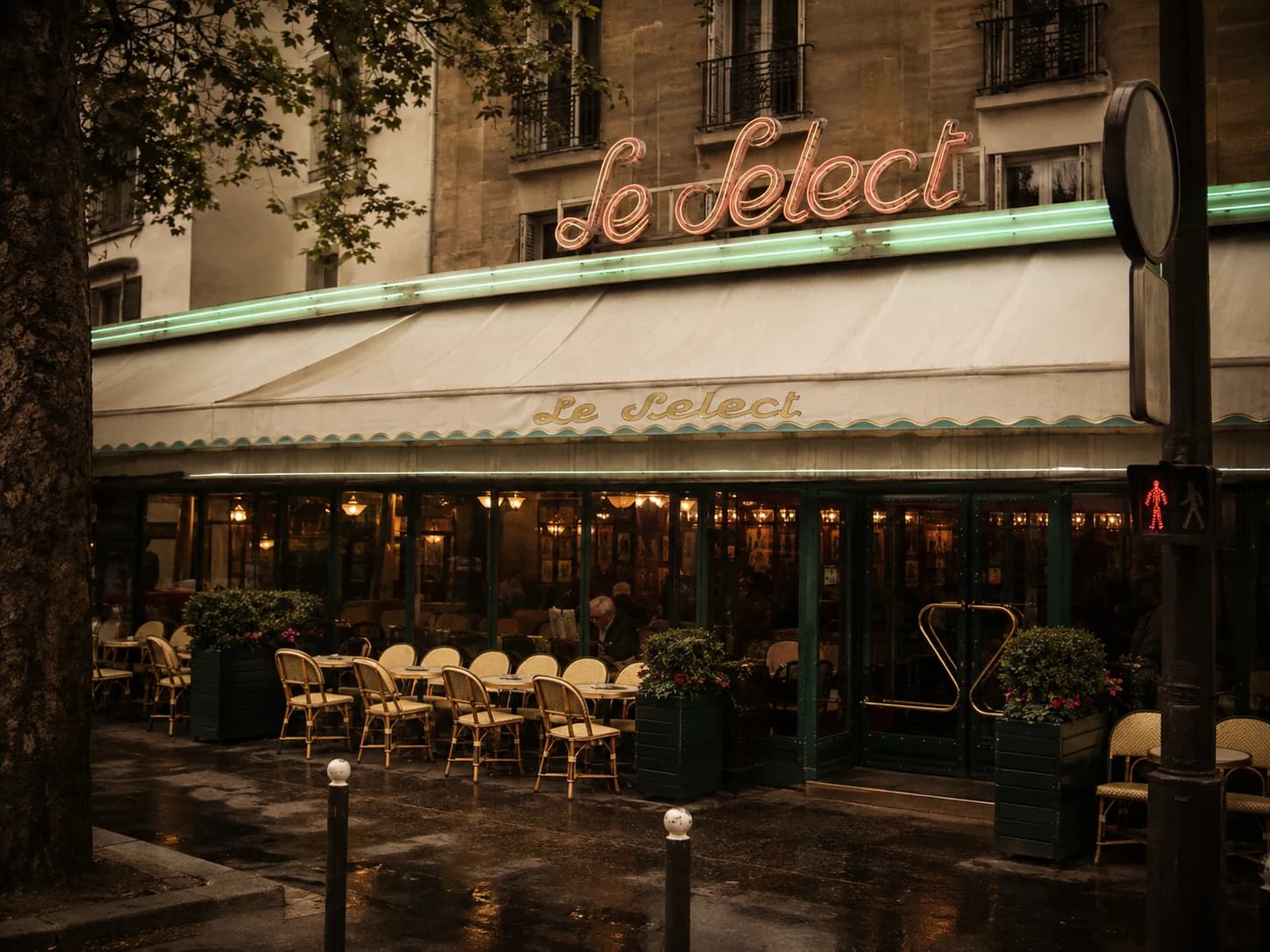 The neon sign and sidewalk terrace outside Le Select in Montparnasse