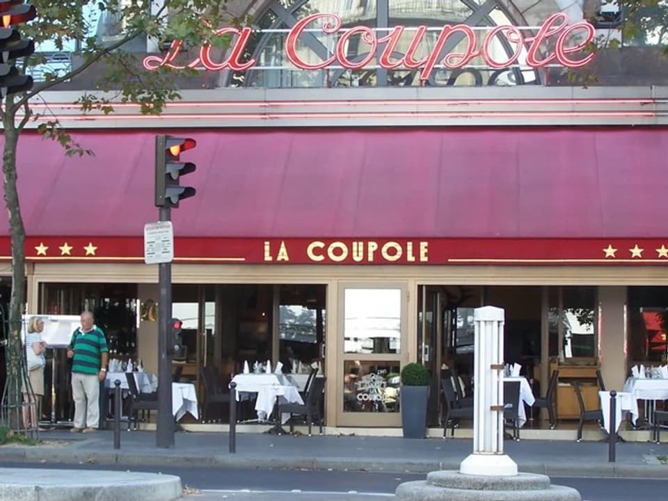 The red awning and terrace of La Coupole on boulevard du Montparnasse