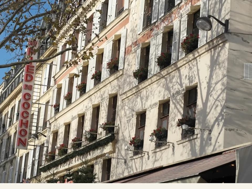 The corner facade of Au Pied de Cochon near Les Halles in Paris