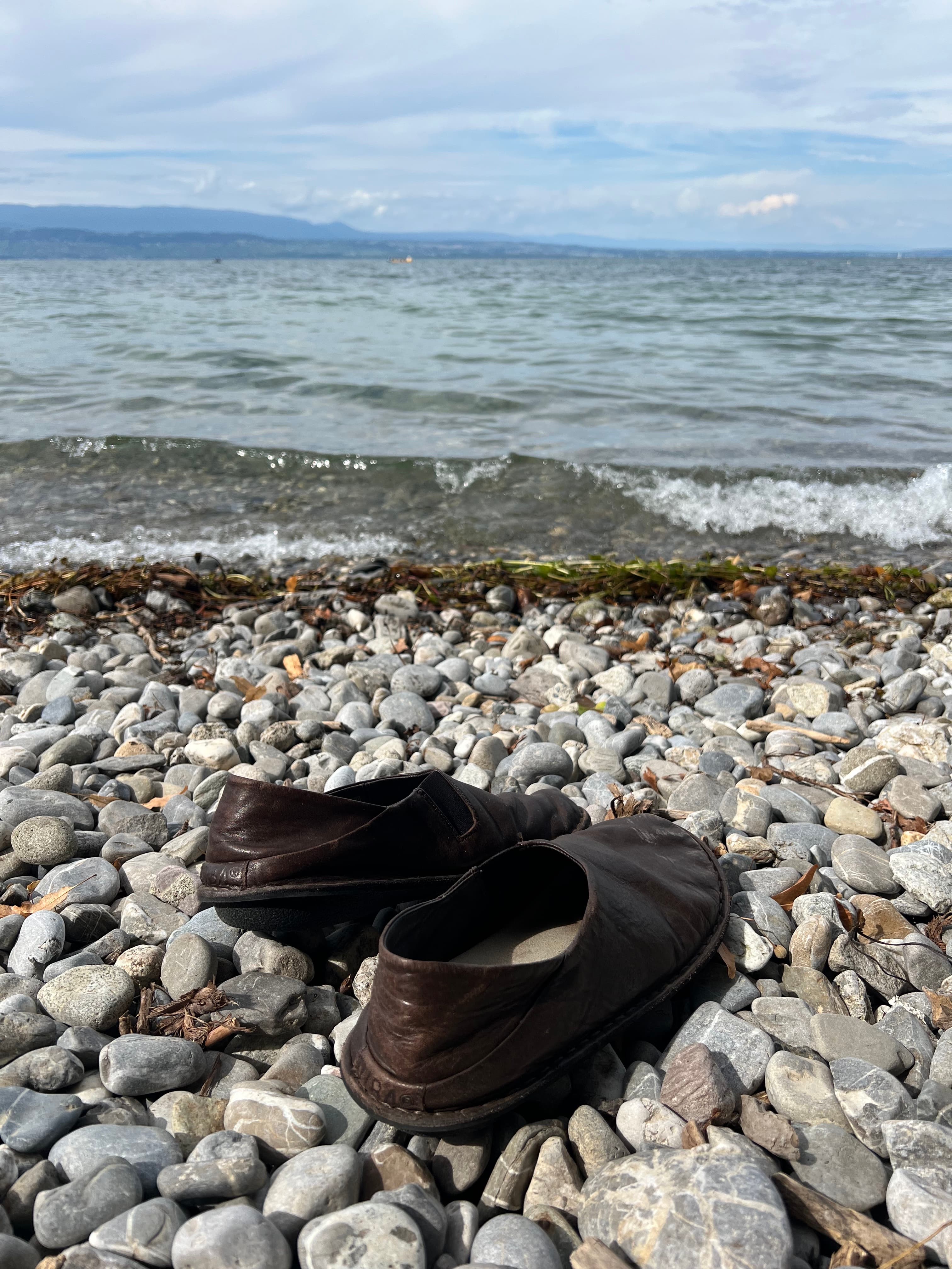The pebble beach and clear lake water at Sciez-sur-Léman