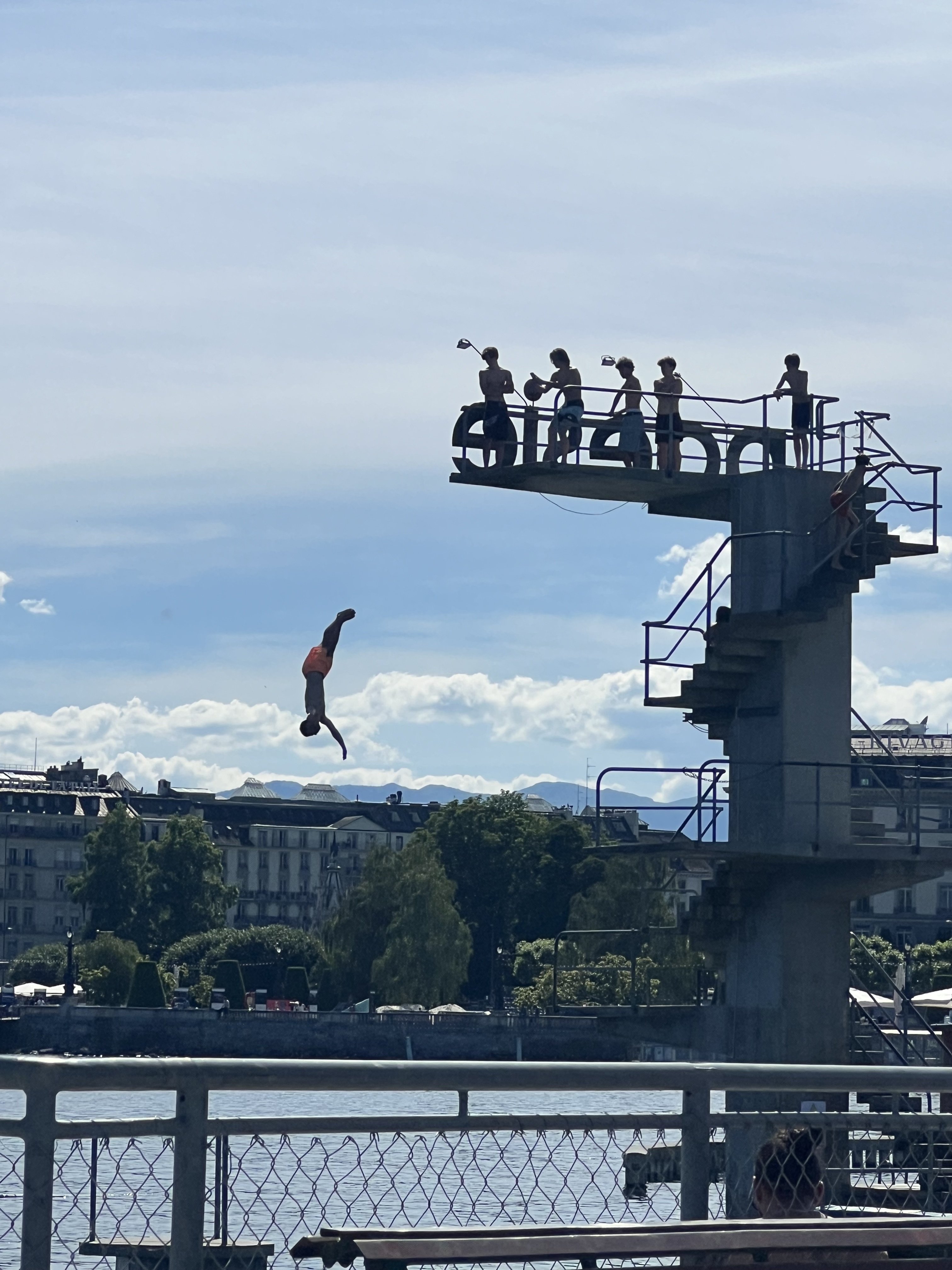 Diver in mid-air off the high board at Bains des Pâquis, Geneva