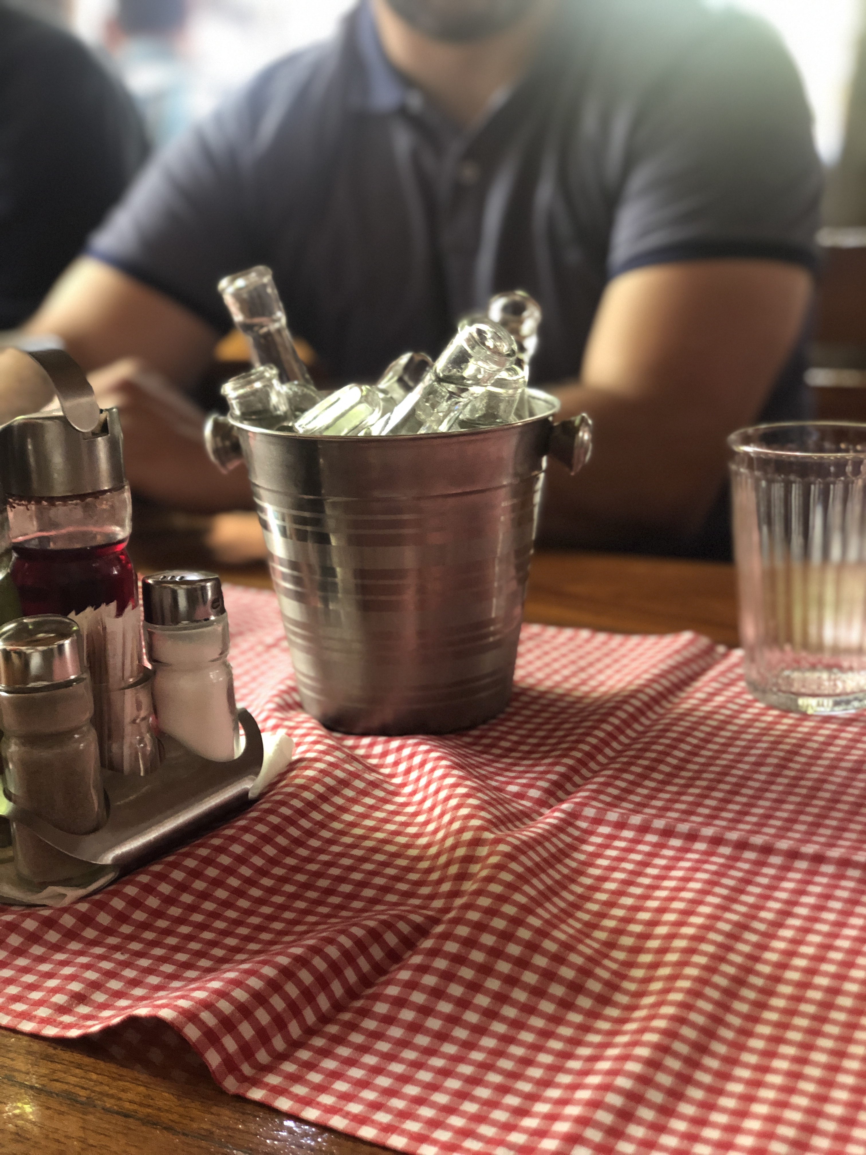 A steel bucket of rakia vials on ice, Bates restaurant Subotica