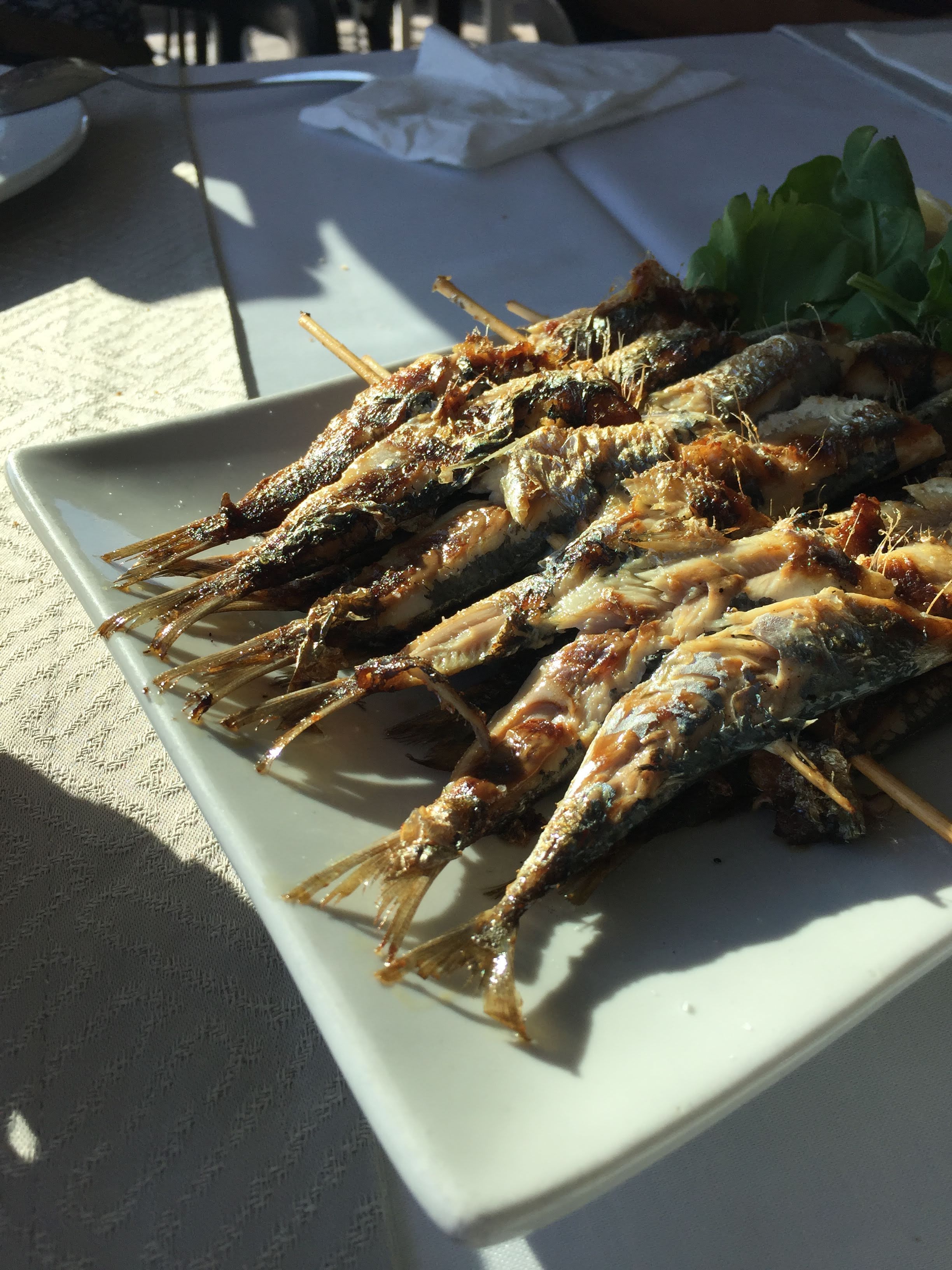 Grilled sardines on skewers at Filinta — the kind of thing raki was made for