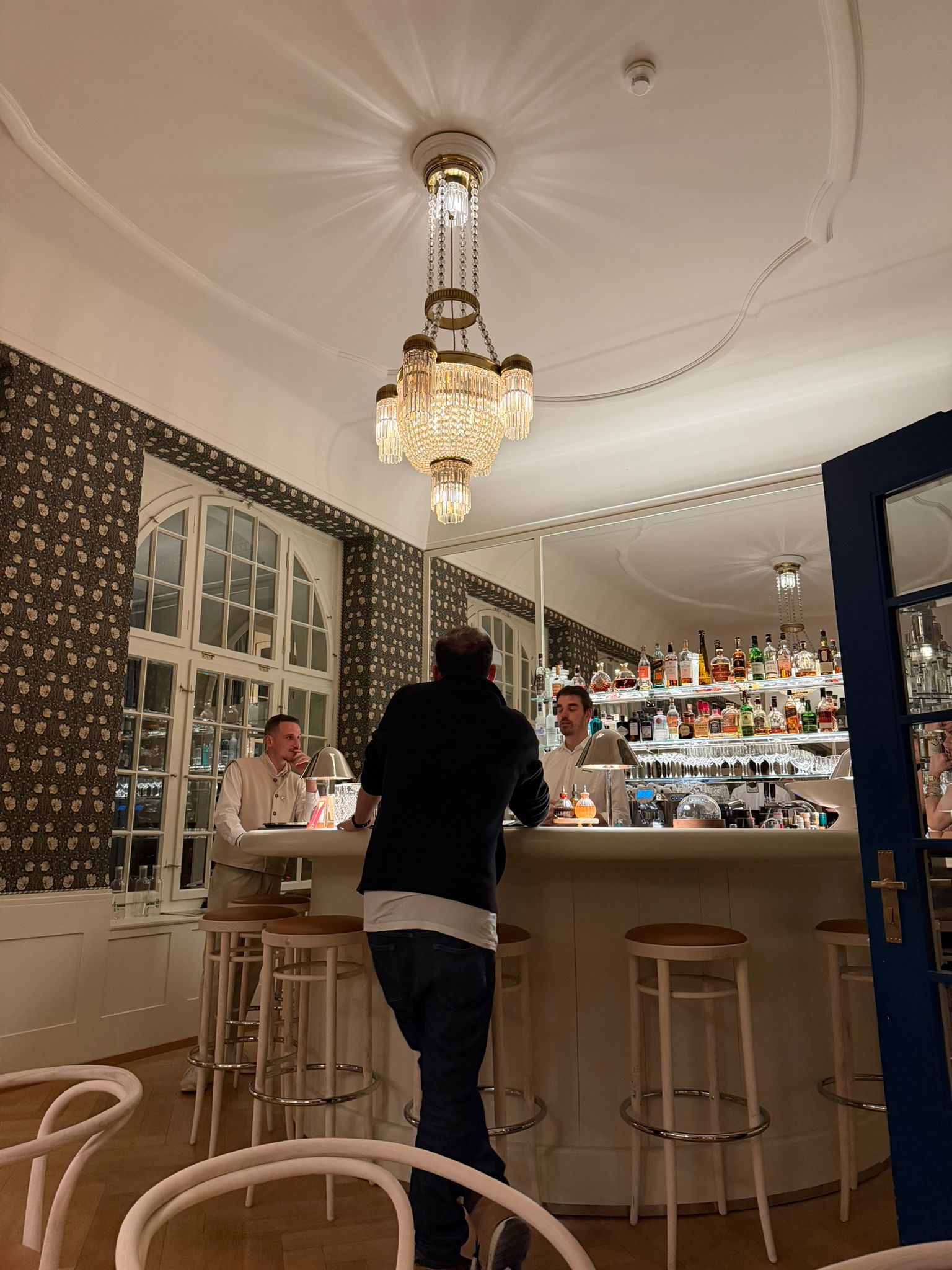 Grand Hotel Belvedere bar, chandelier, dark floral wallpaper