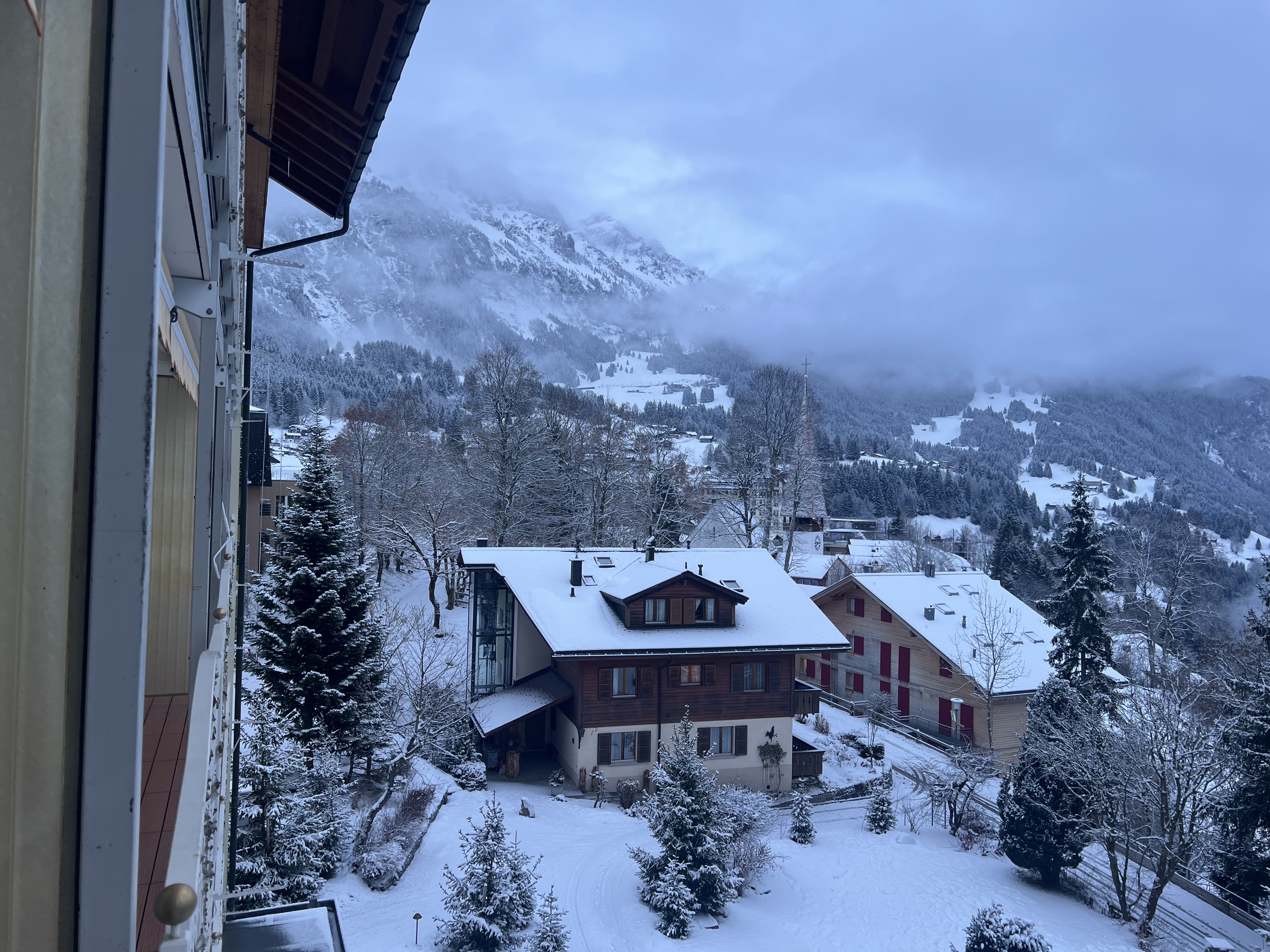 Wengen village rooftops in snow, view from Belvedere hotel room