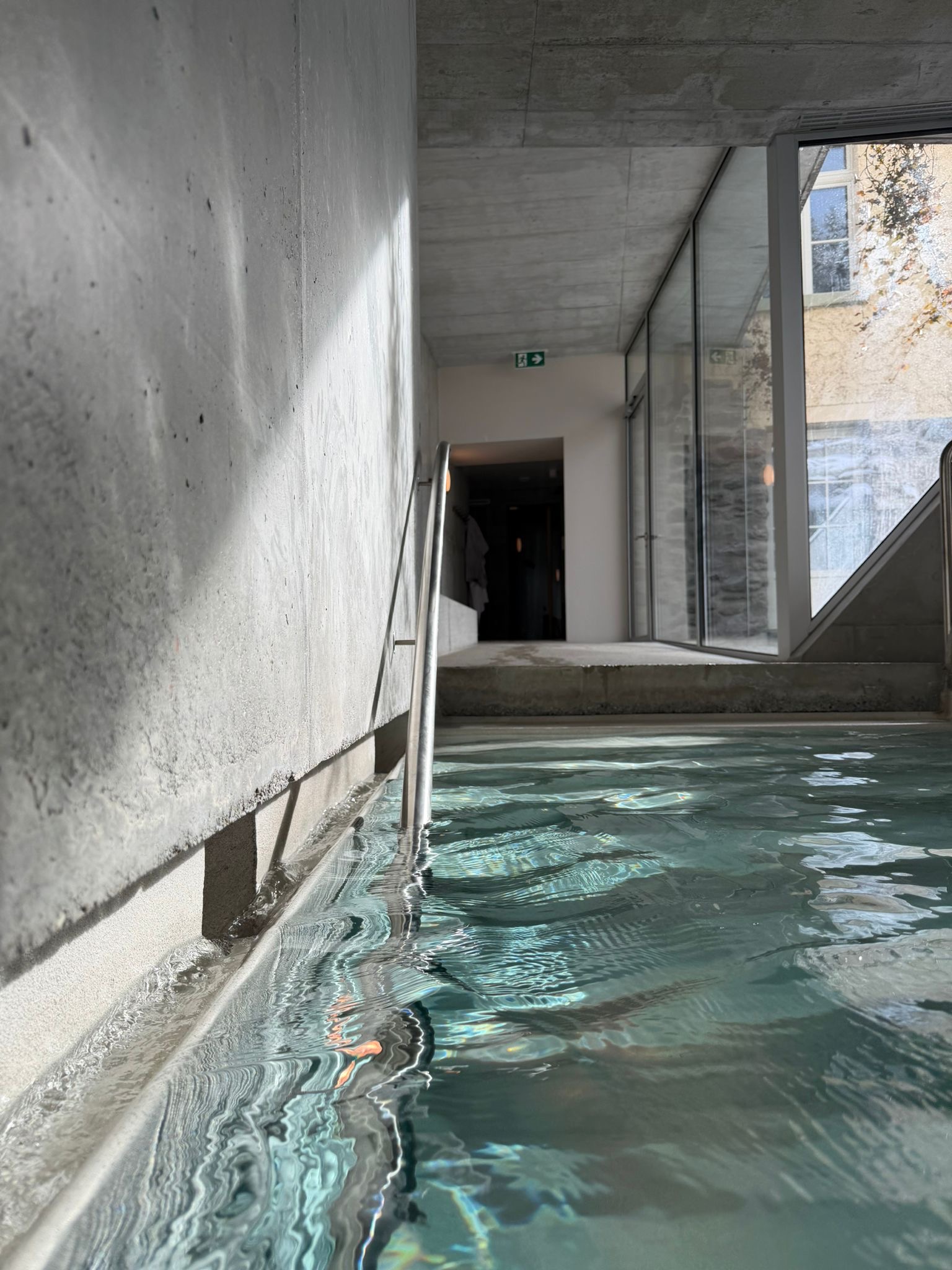 Grand Hotel Belvedere spa indoor pool, raw concrete architecture