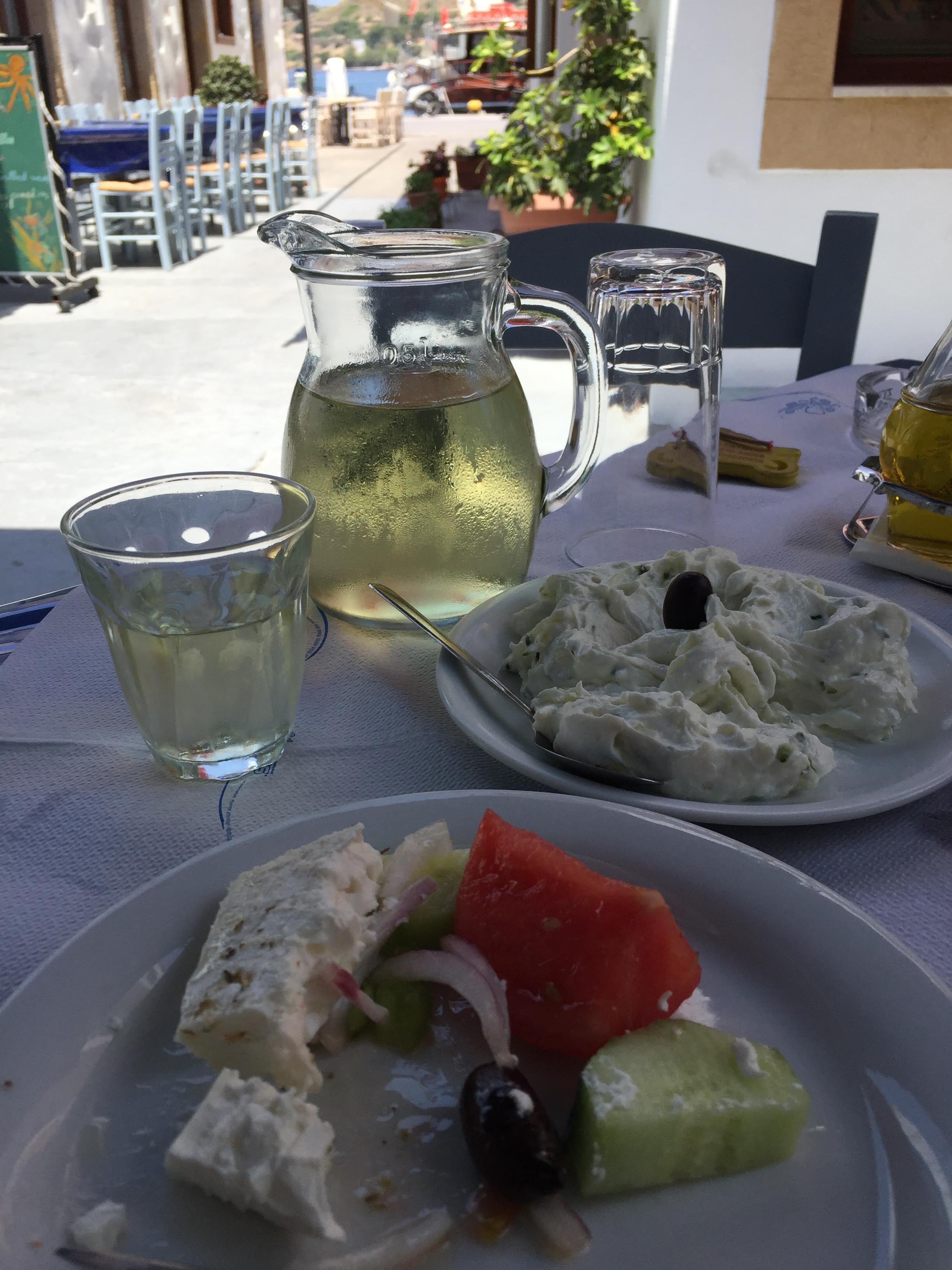 Greek house white wine in a small carafe