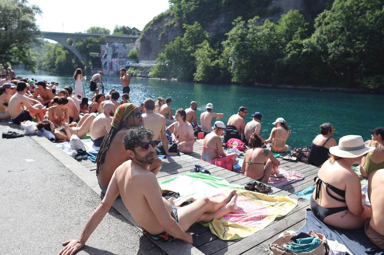 La Jonction, Geneva — swimmers on the dock where the Rhône meets the Arve