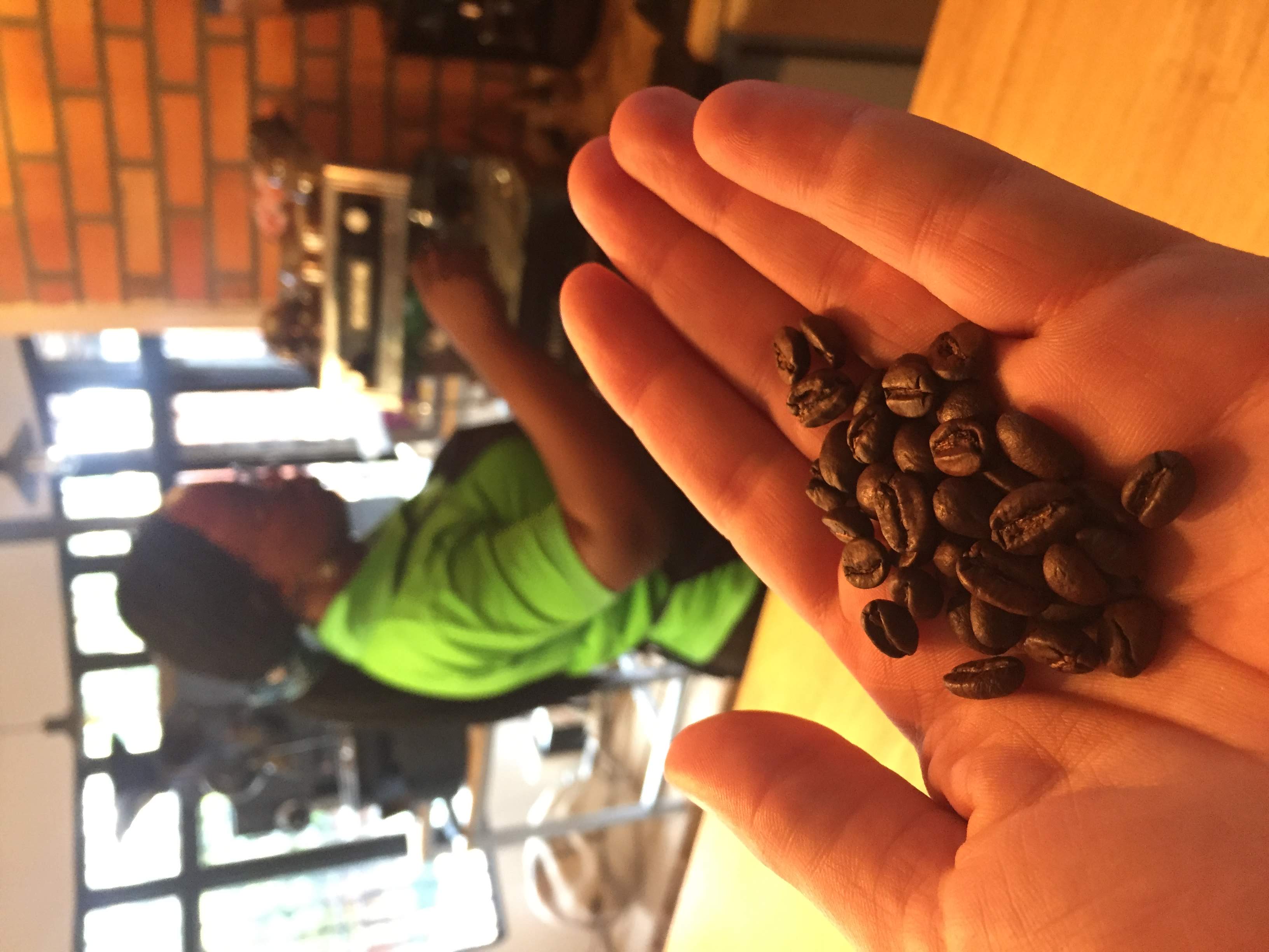 Question Coffee espresso in a ceramic cup with wooden spoon, Kigali