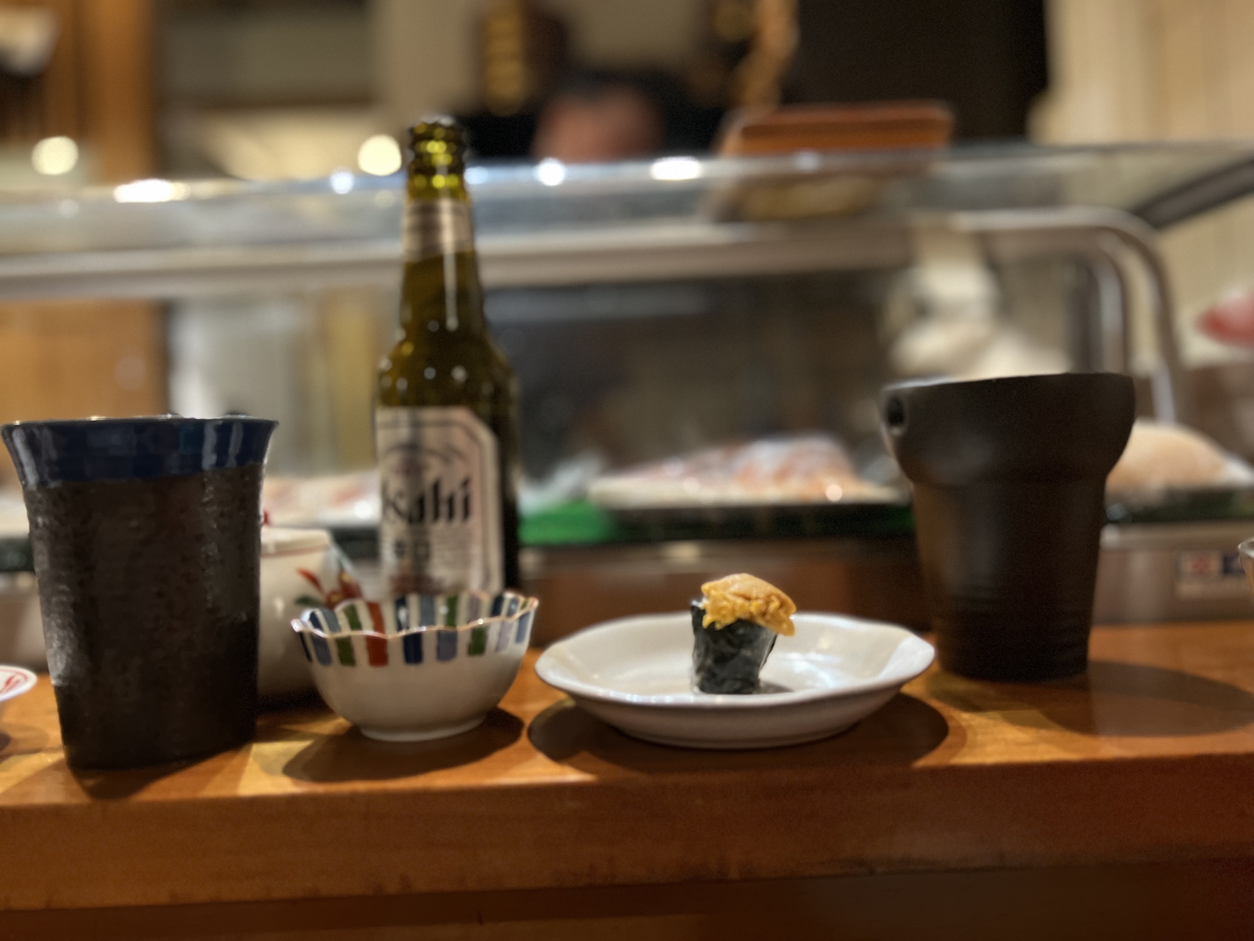 Sake bottle and uni at Nagomi counter, Geneva