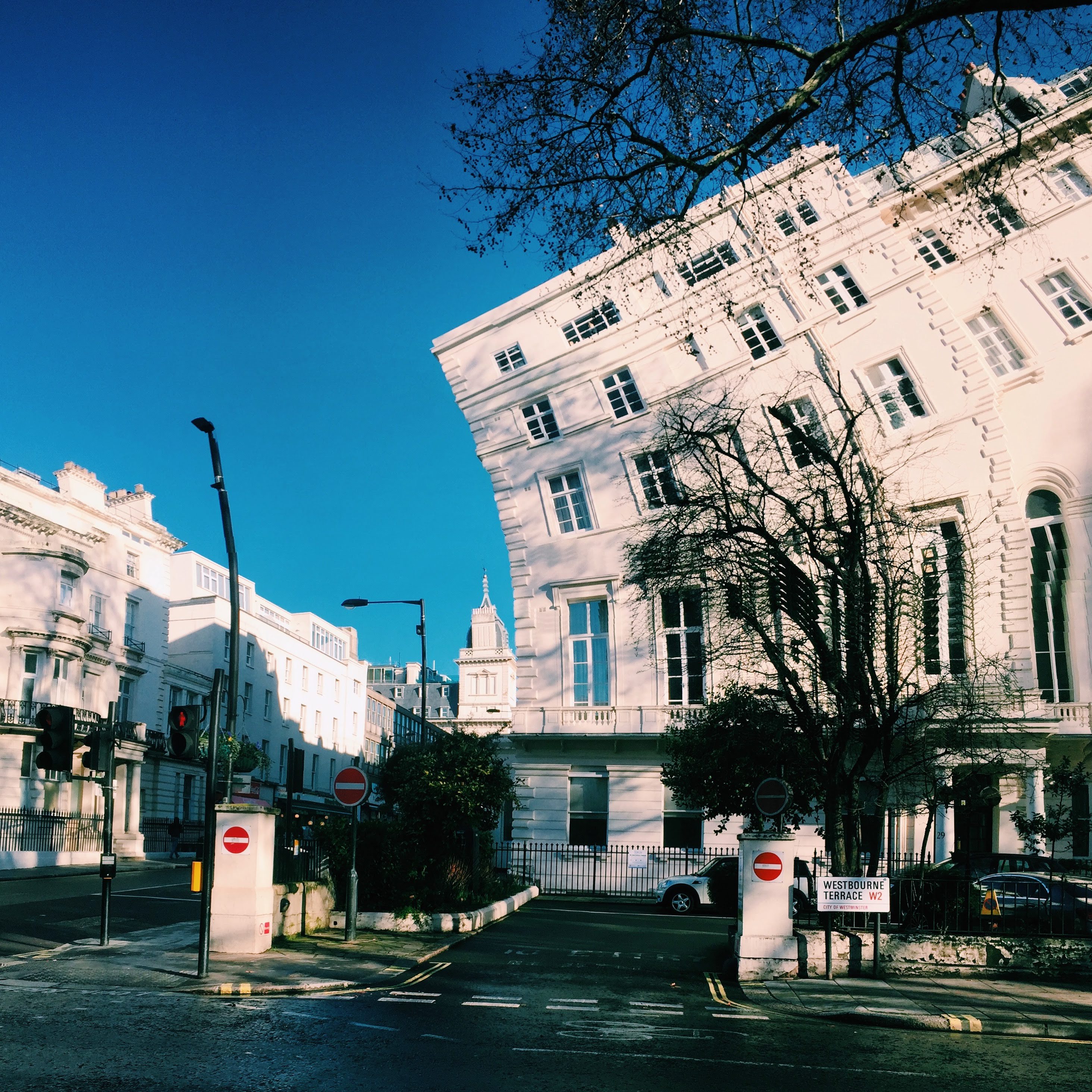 Westbourne Terrace W2, white stucco buildings, panorama distortion, blue sky