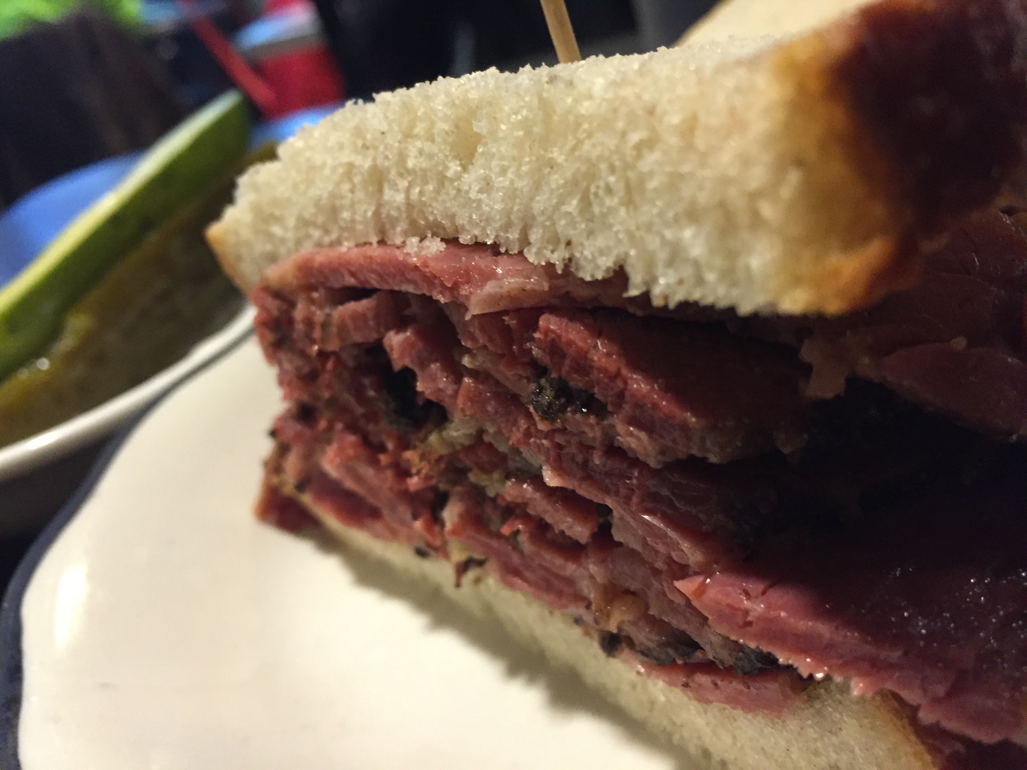 Pastrami Queen sandwich cross section — thick cut pastrami on rye