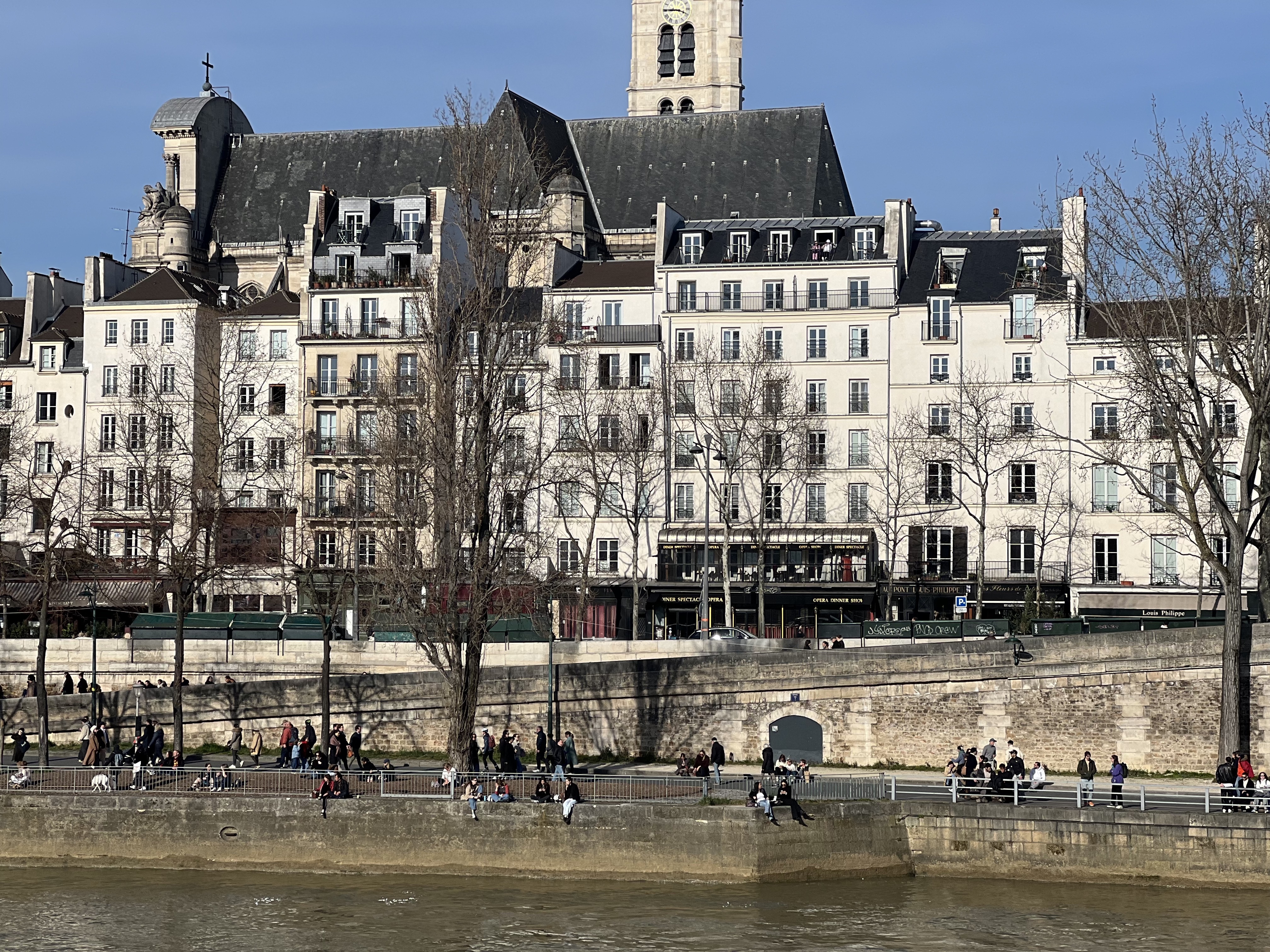 Seine riverbank, Paris — afternoon light, people on the quai