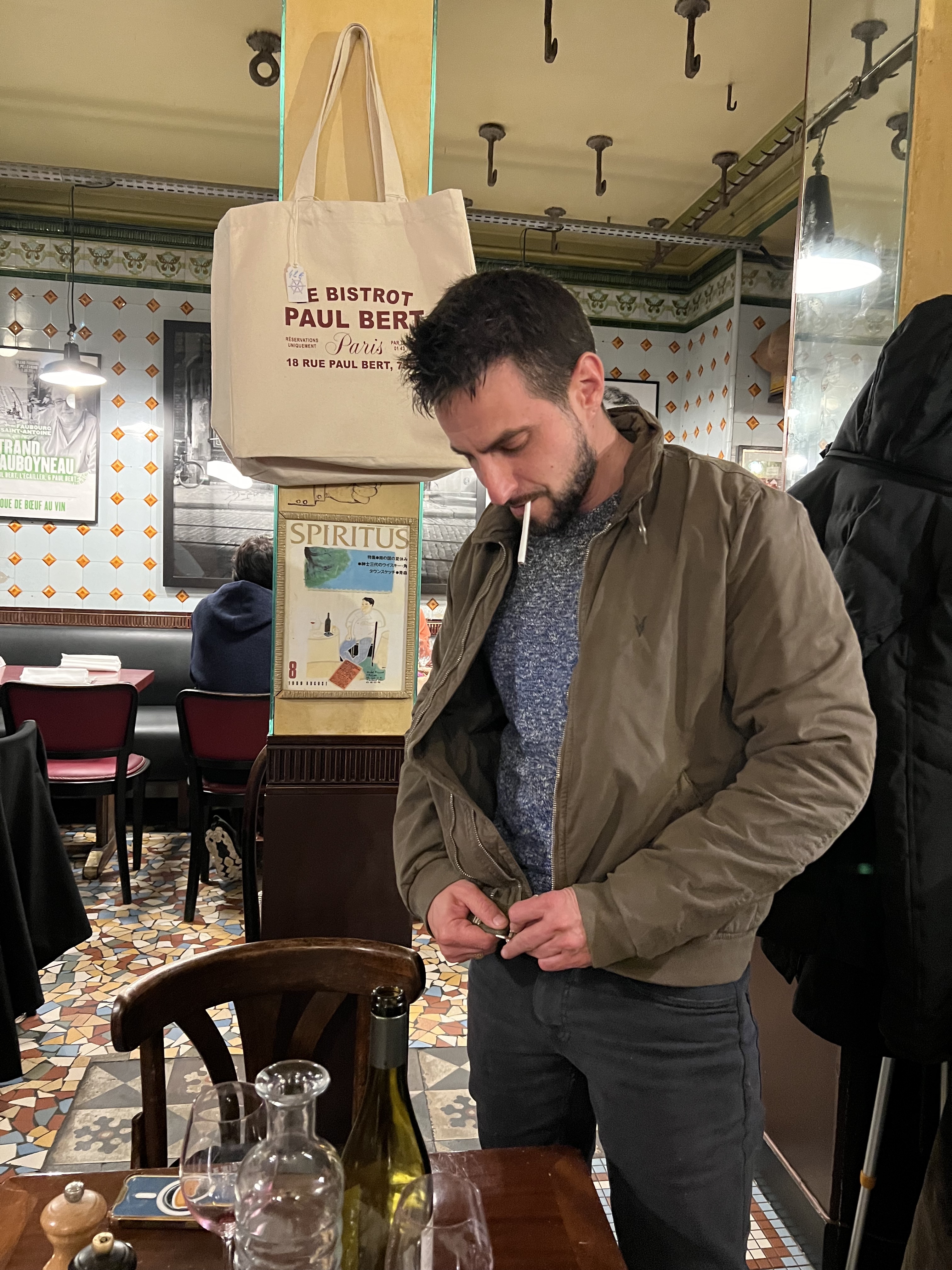 Inside Paul Bert — tote bag, tiled floor, coat hooks, mirrors