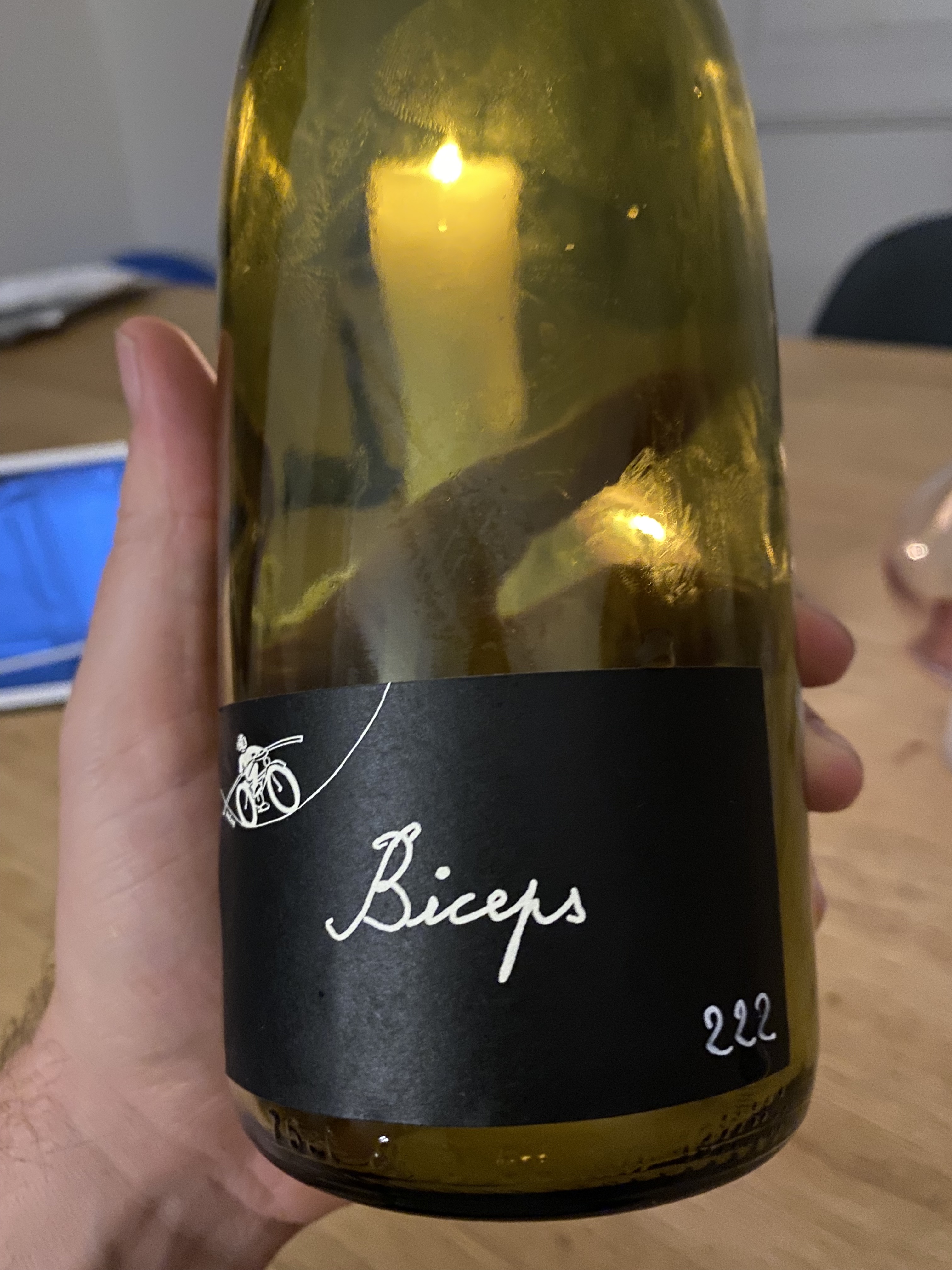 Paul-Henri Soler Biceps bottle held up to candlelight